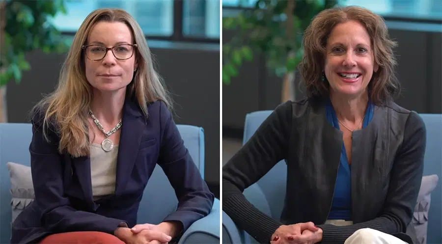 People in an office smiling