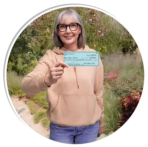 Female retiree holding retirement check