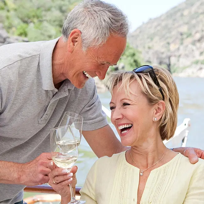 Retired drinking wine outside