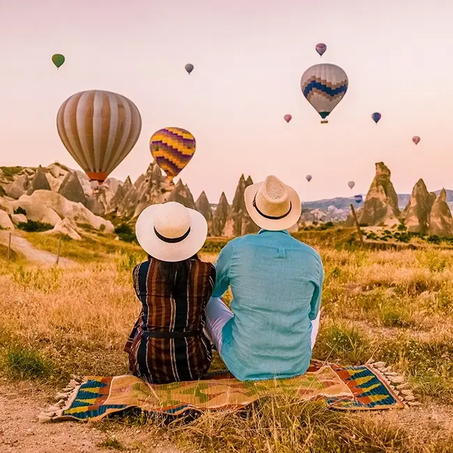 Couple watching hot air balloons