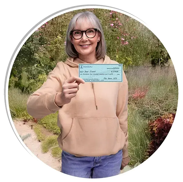 Female retiree holding retirement check