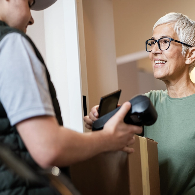 Older women greeting the postman